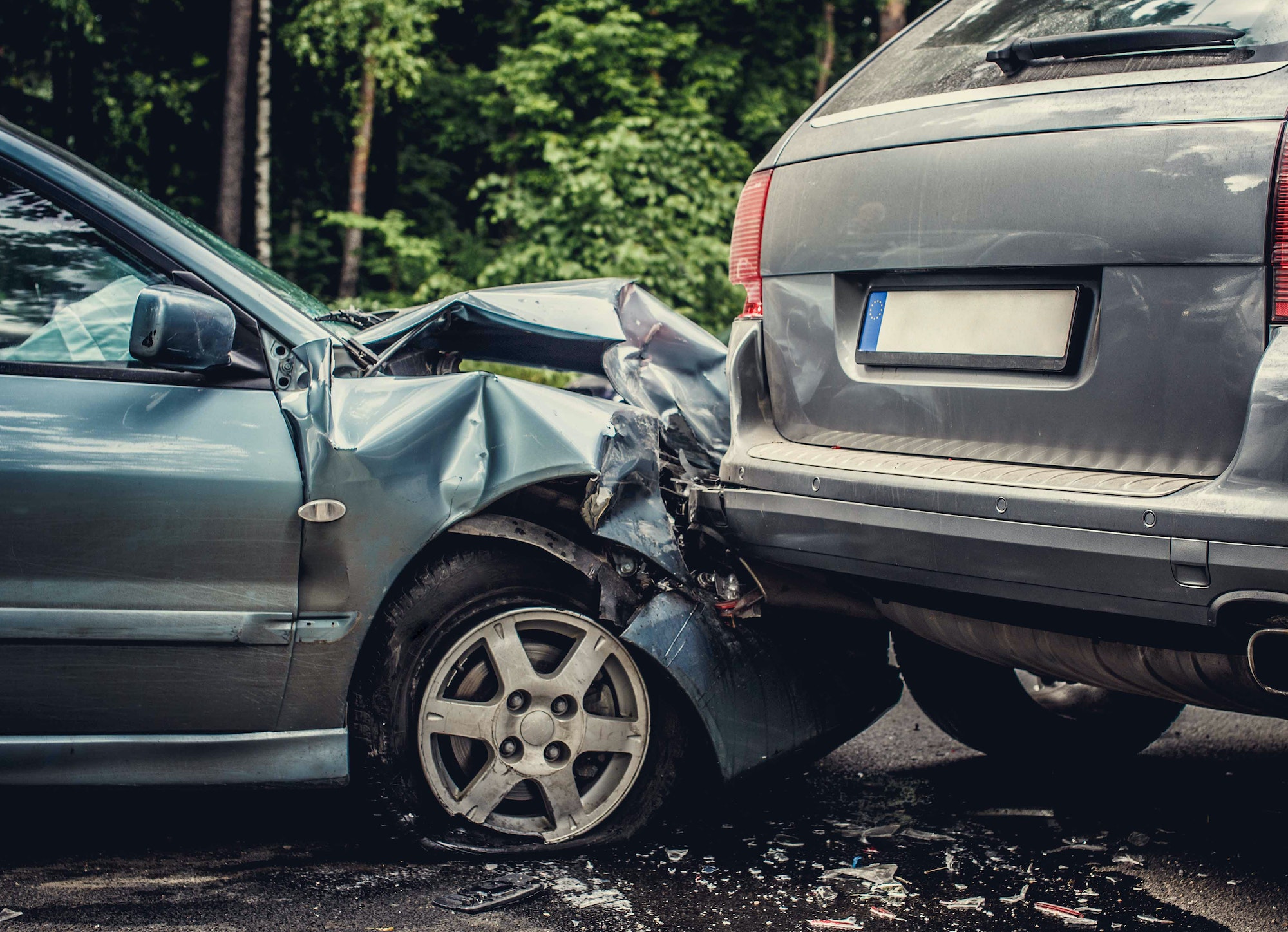 Close up smached cars on a road.