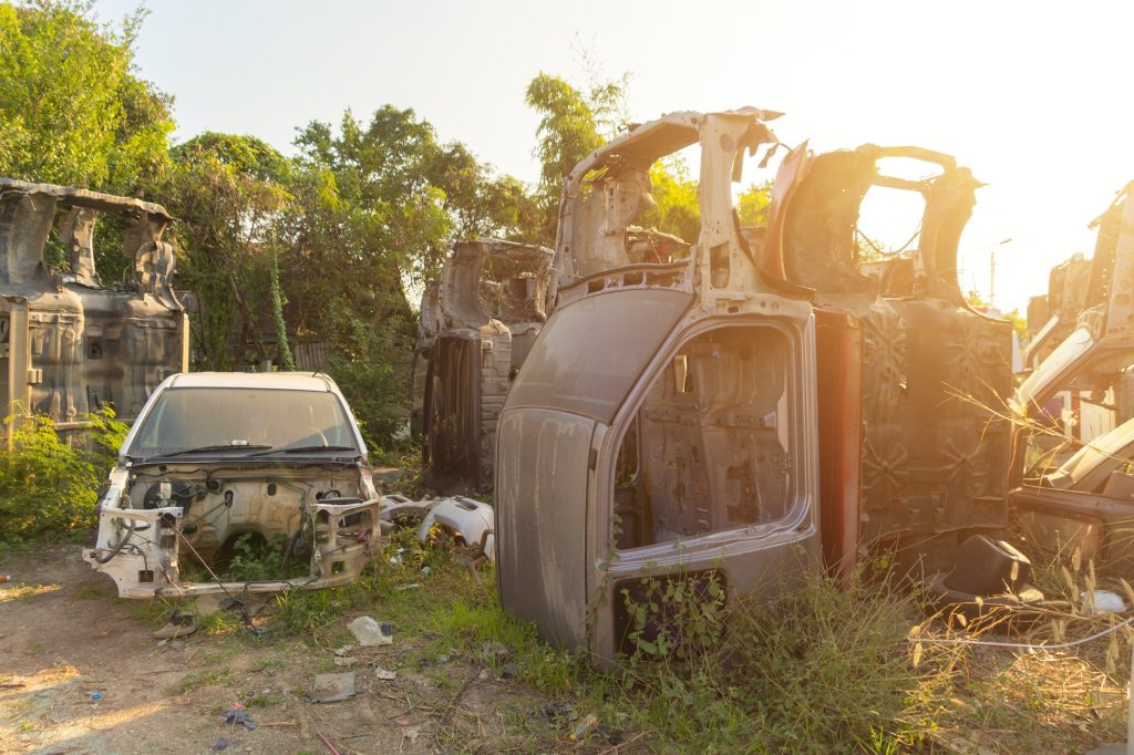 Industry factory of broken old cars crash from accidents. Transportation used vehicles.